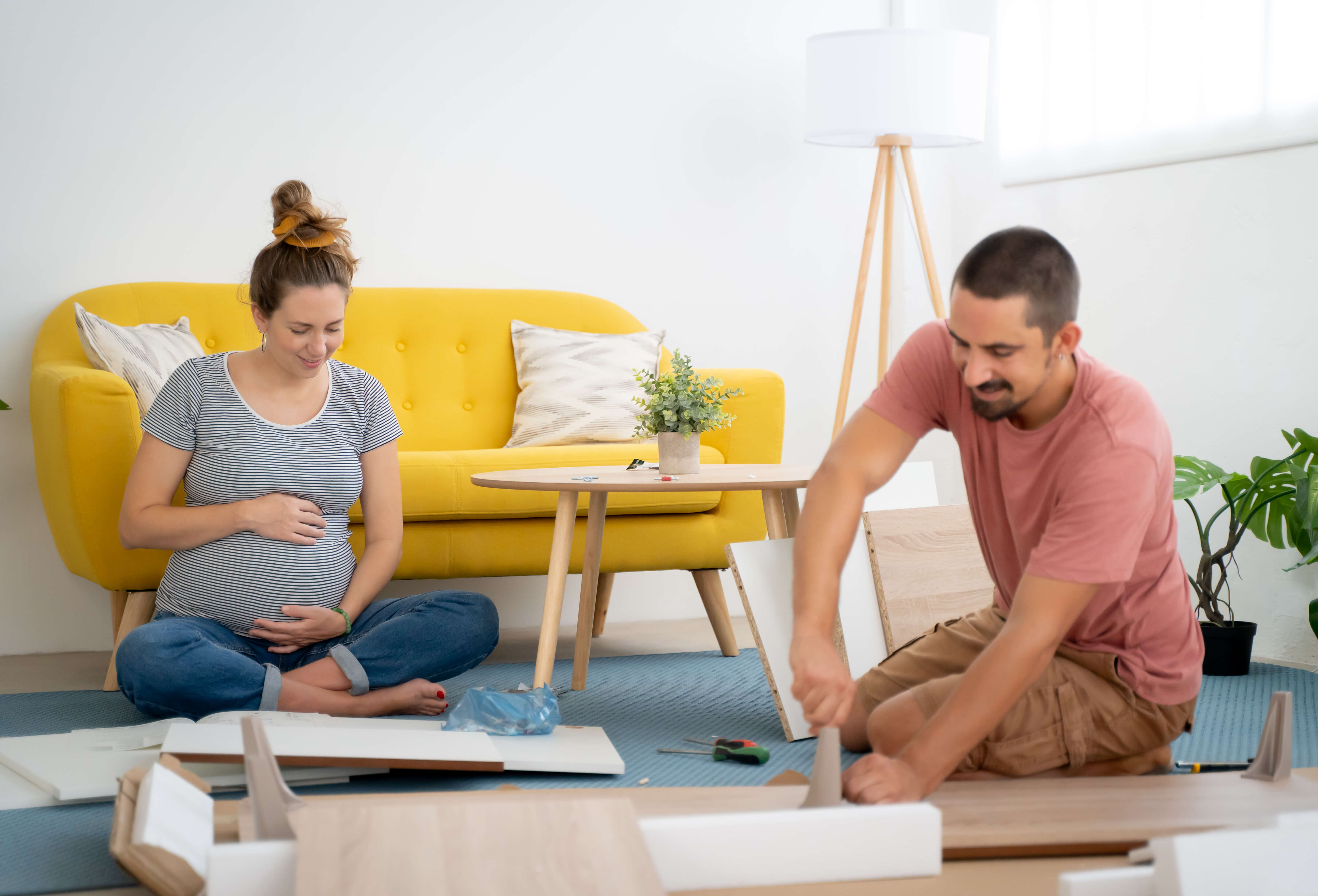 Pregnant Couple Assembling Furniture